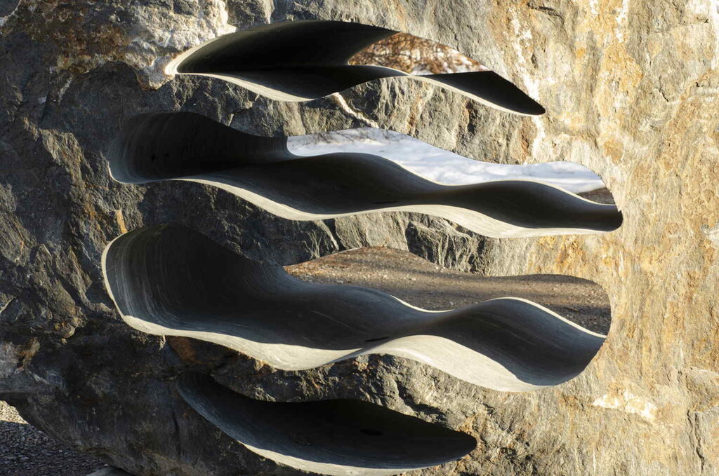 Custom stone sculpture LED landscape lighting