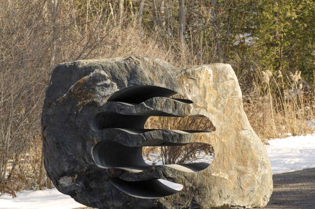 Custom stone sculpture LED landscape lighting