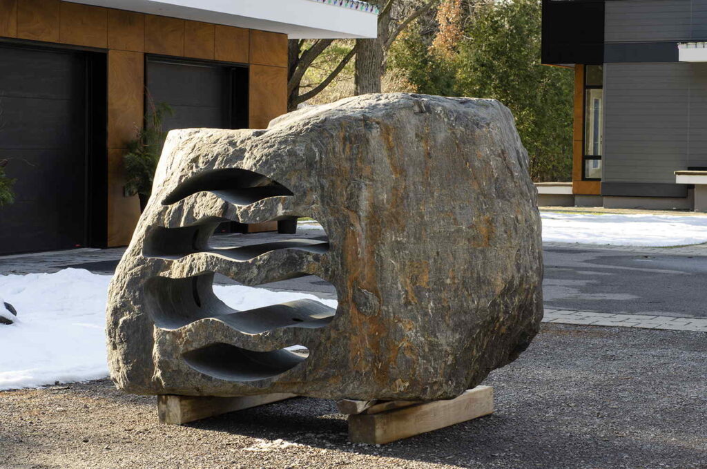 Custom stone sculpture LED landscape lighting