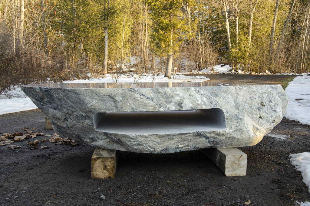 Polished stone boulder coffee table